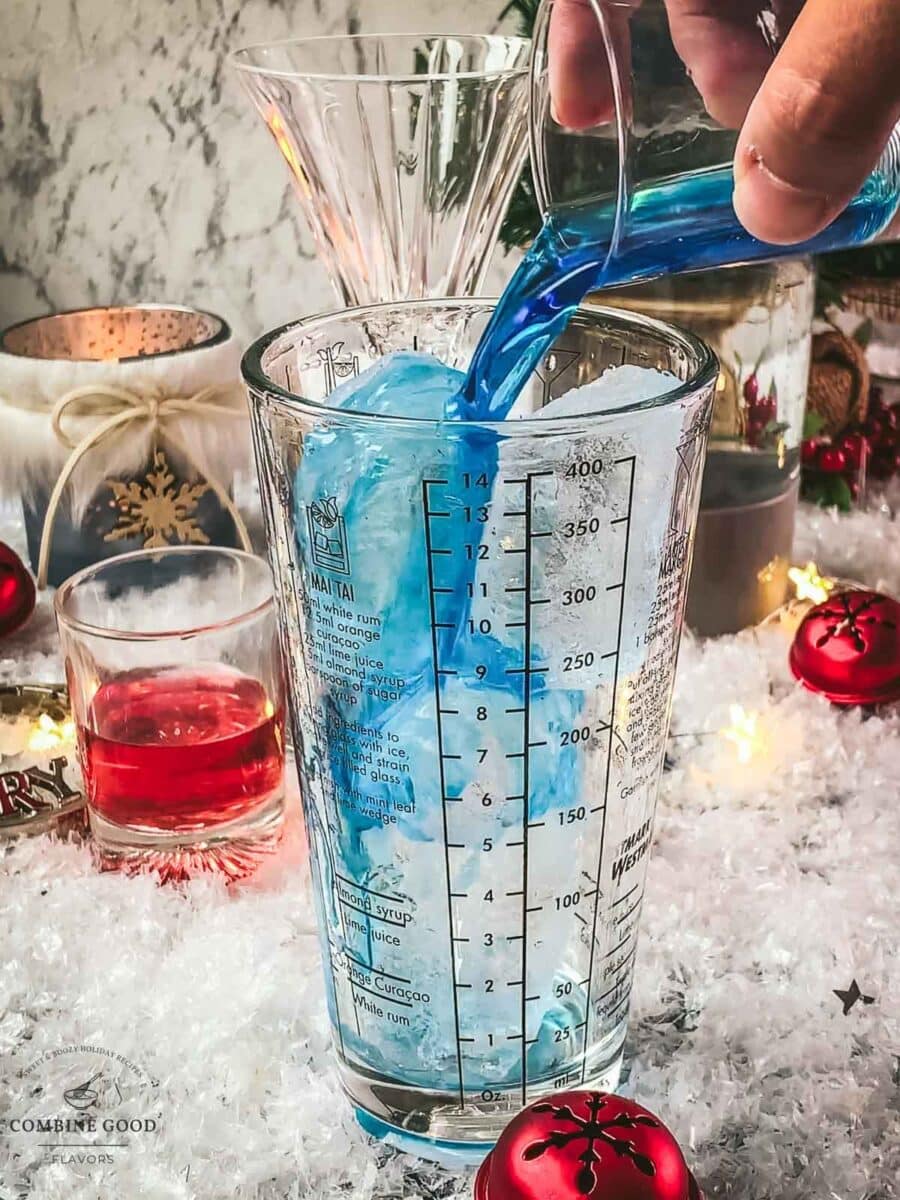 Add the blue curaçao to your cocktail shaker.