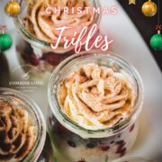 Gorgeous mini Christmas triffles with delicious speculoos cookies, a mascarpone cream mix, and frozen berries. Served in small preserving jars.