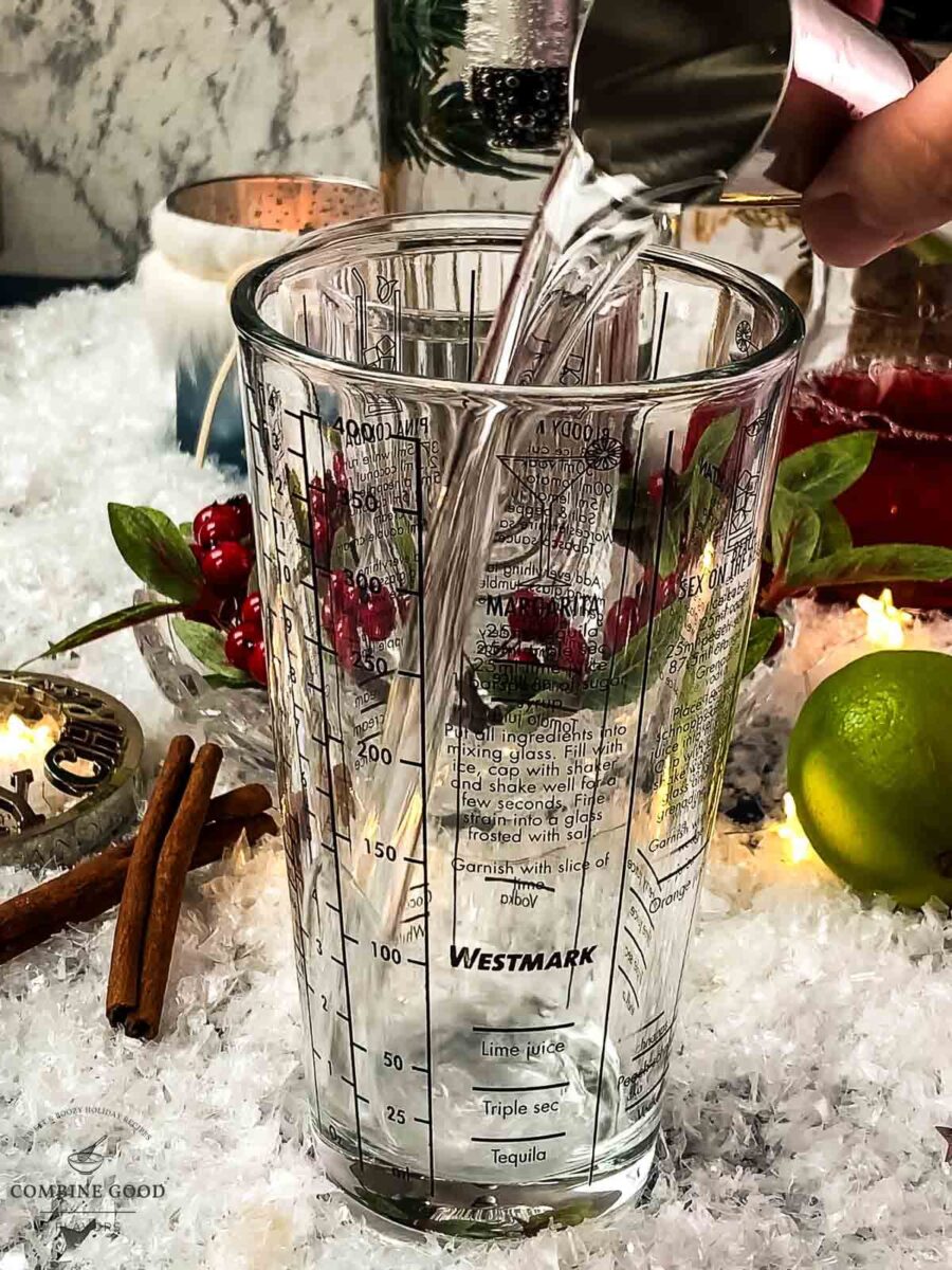 Add gin to the cocktail shaker.