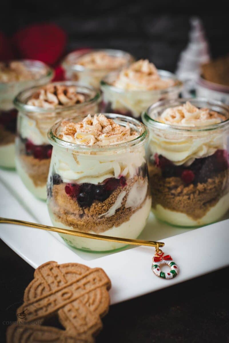 Gorgeous mini Christmas triffles with delicious speculoos cookies, a mascarpone cream mix, and frozen berries.