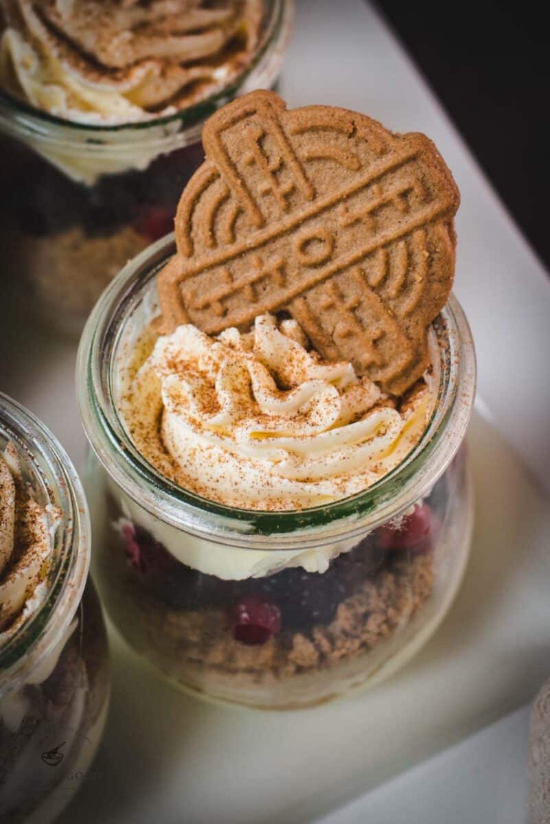 Gorgeous mini Christmas triffles with delicious speculoos cookies, a mascarpone cream mix, and frozen berries.