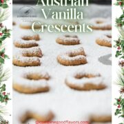 Sugar dusted vanilla crescent cookies on baking sheet.