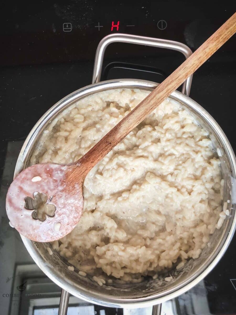 Simmer until the vanilla milk rice mixture thickens.