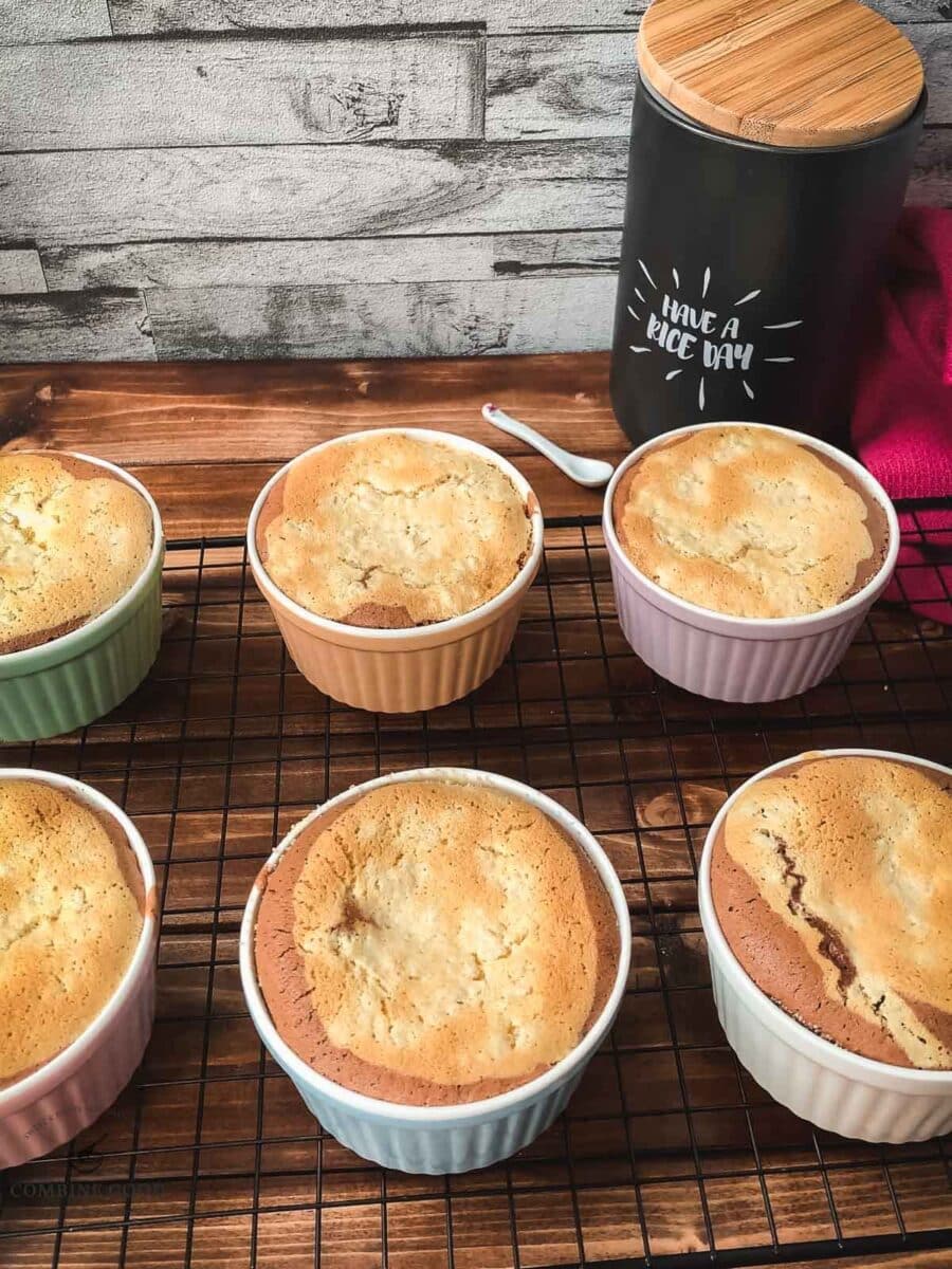 Finished baked marbled rice pudding casseroles on cooling rack before serving.