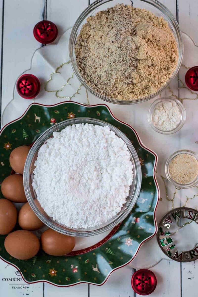 Ingredients Haselnussbusserl - hazelnut meringue cookies - powdered sugar, ground hazelnuts, egg whites, breadcrumbs, and cake flour.