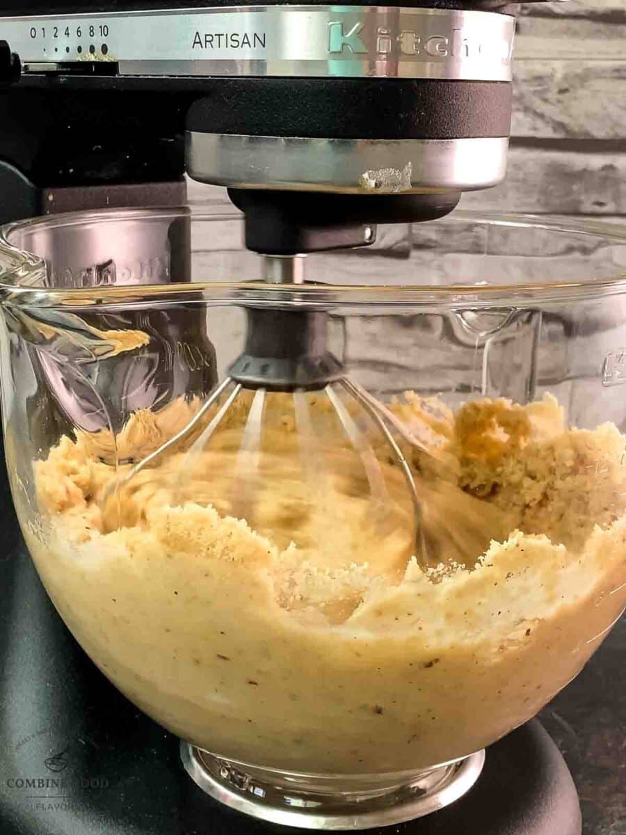 Kitchen machine whisking hazelnut batter.