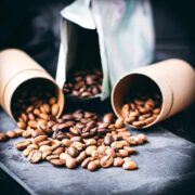 Black slate plate with three different kinds of coffee beans.