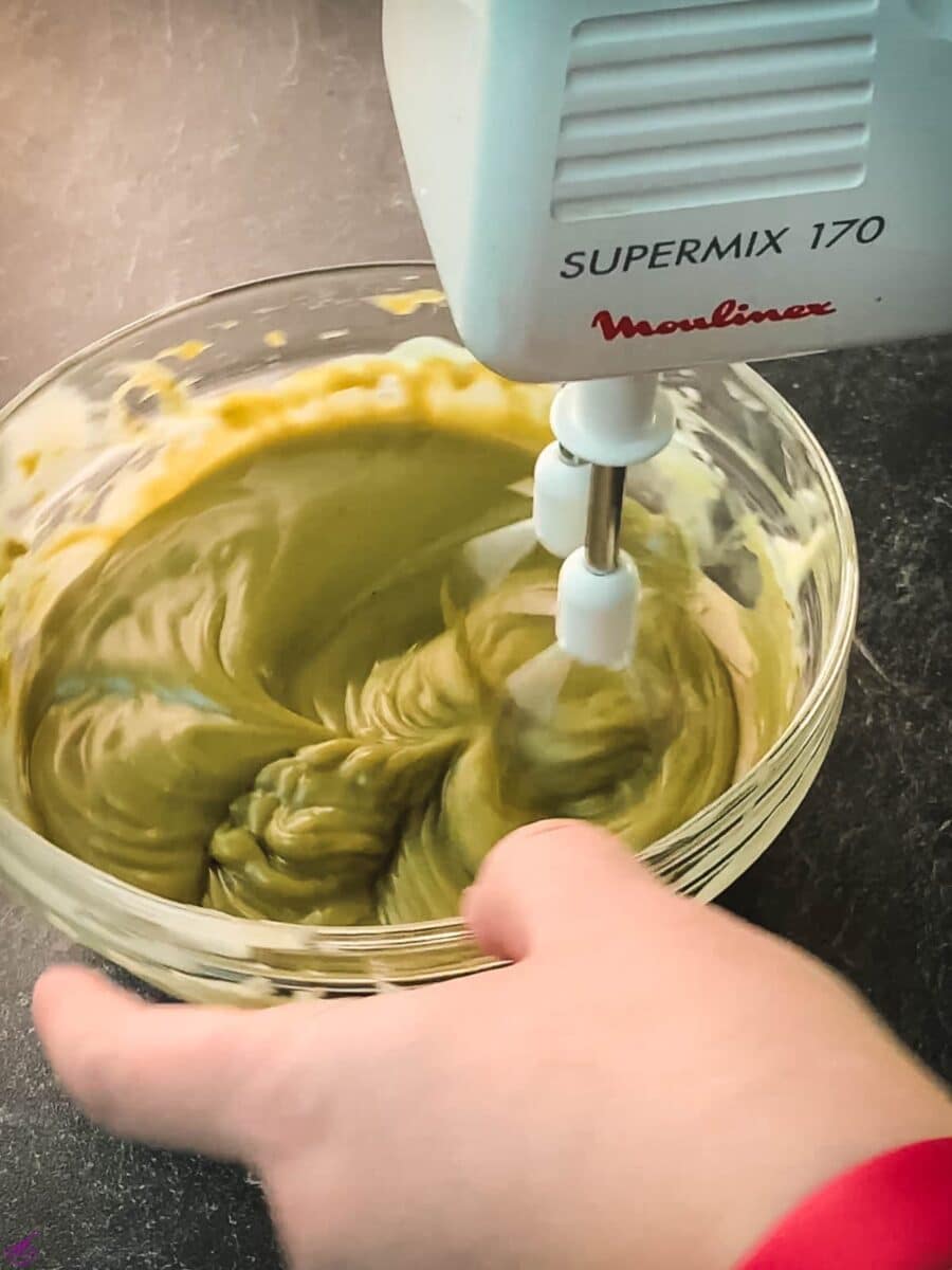 Whip up the chilled pistachio ganache using a hand held or stand mixer.