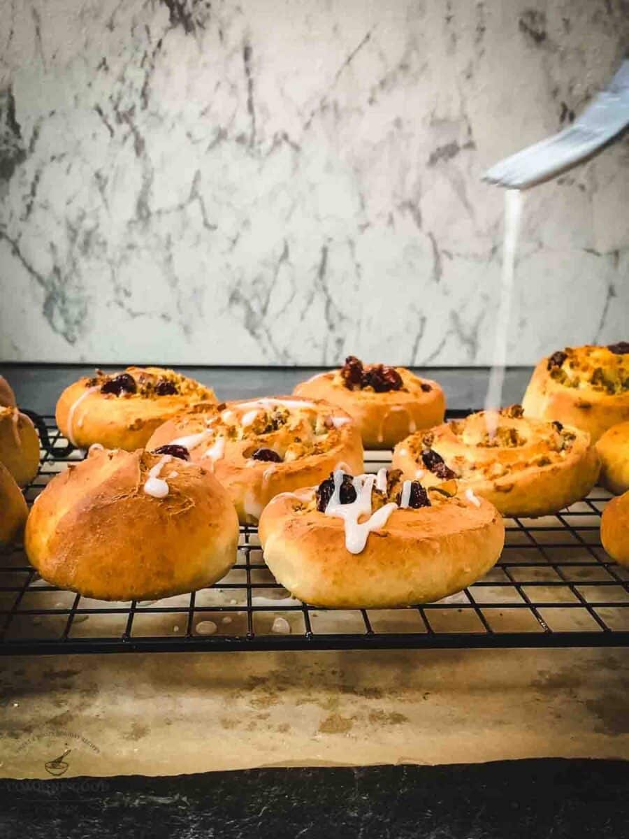 Drizzle the rosewater glaze on top of the pistachio rolls.