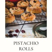 Delicious, mini pistachio sweet rolls on cooling rack.