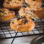 Delicious, mini pistachio sweet rolls on cooling rack.