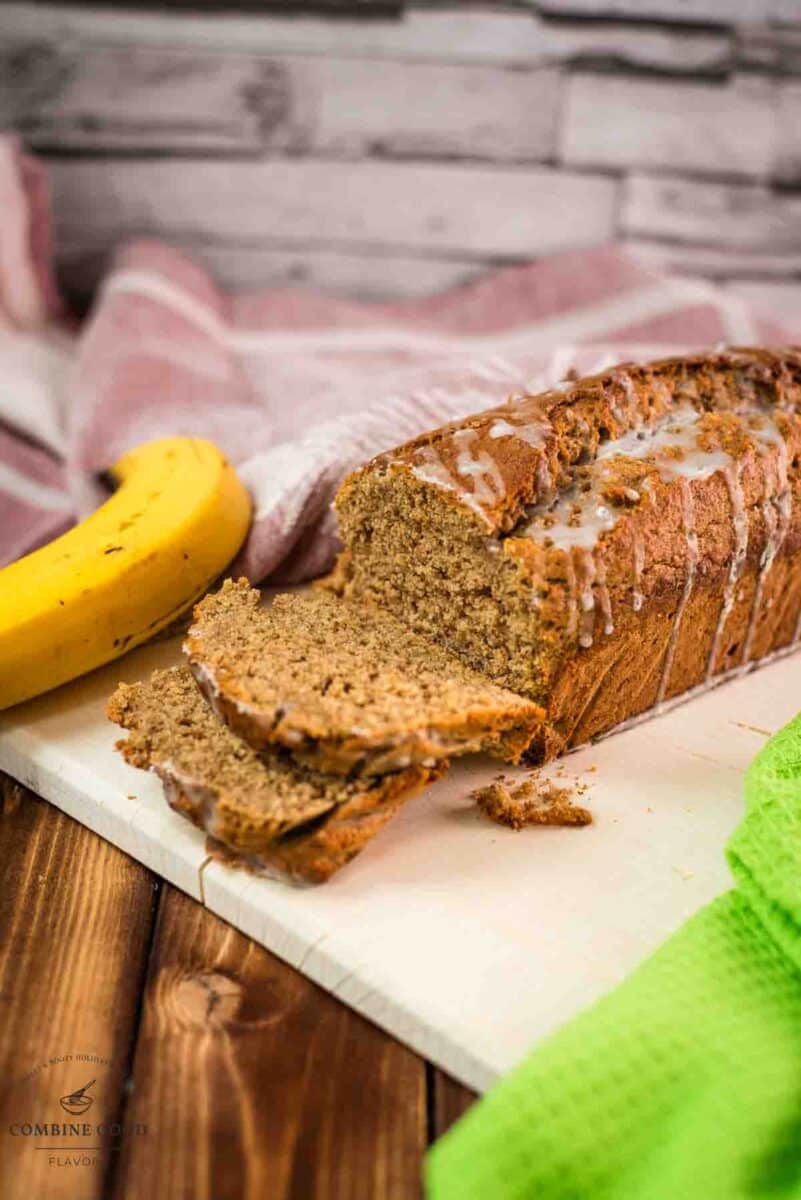 Delicious low sugar banana loaf bread, with light sugar glaze drizzled over the banana bread.