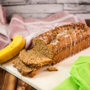 Delicious low sugar banana loaf bread, with light sugar glaze drizzled over the banana bread.