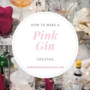 Cocktail glass filled with an elegant pink gin cocktail.