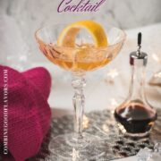 Cocktail glass filled with an elegant pink gin cocktail.