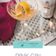 Cocktail glass filled with an elegant pink gin cocktail.