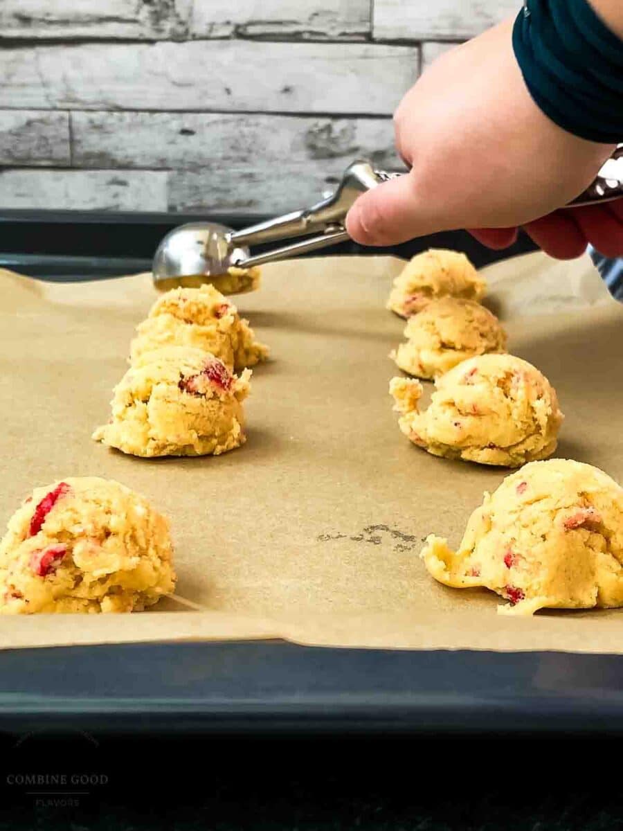 Scoop tablespoon-sized balls of dough onto the baking sheet, spacing them 2 inches apart.