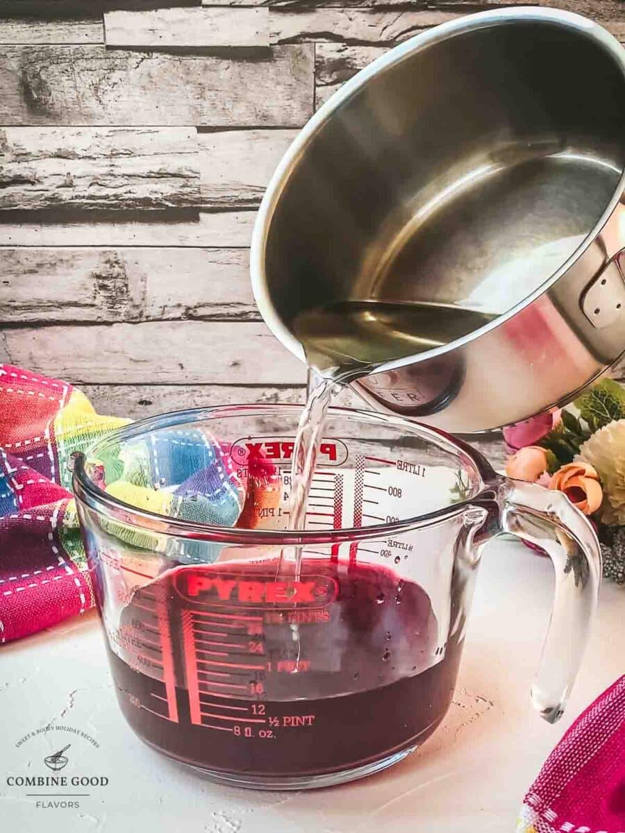 Pour the simple syrup into the jug with the berry infused vodka.