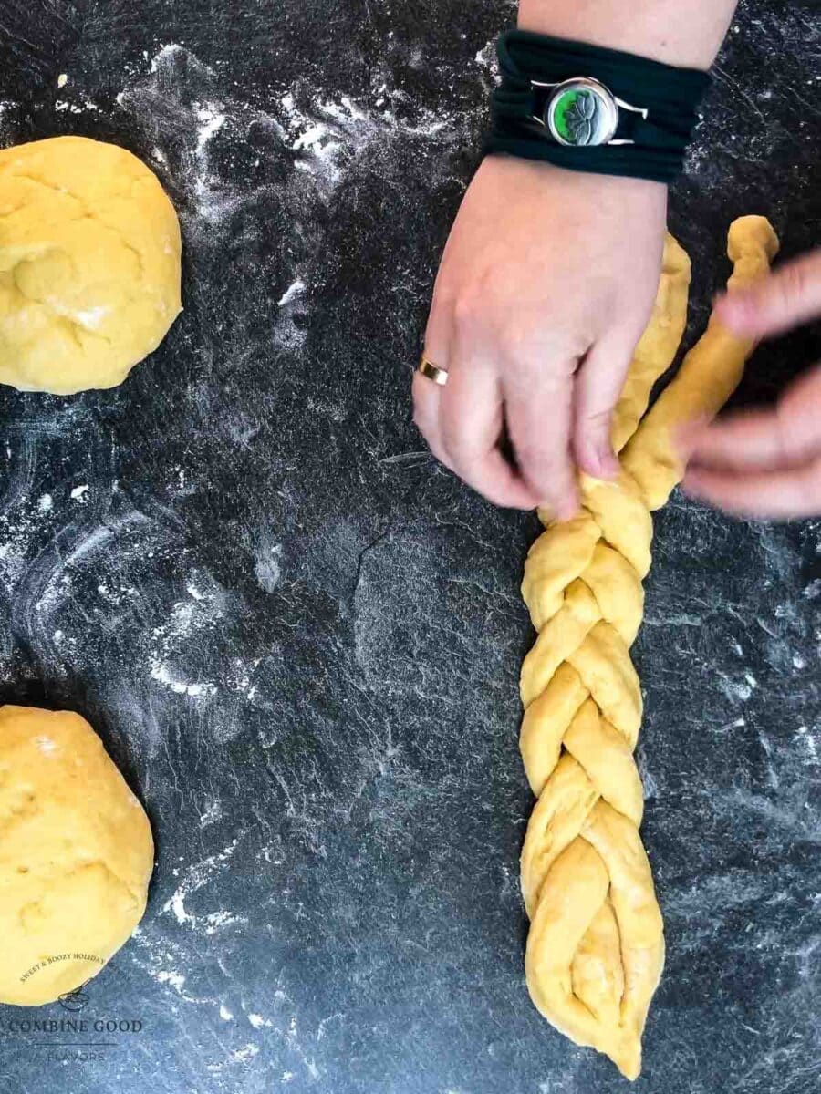 Braid the dough strands into three plaits.