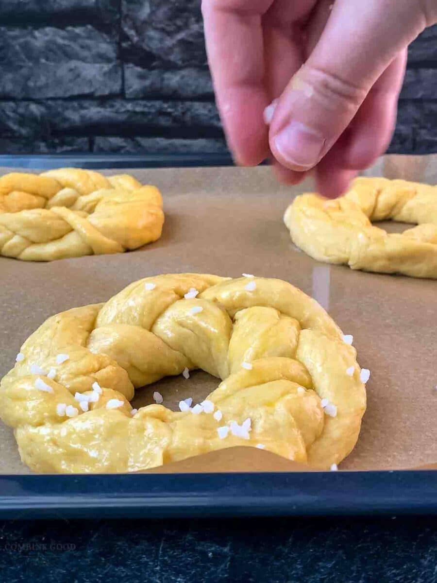 Sprinkle the Easter bread wreaths with nib sugar before baking.