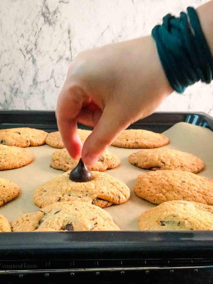 Place the Hershey kiss on top of the hot cookie.