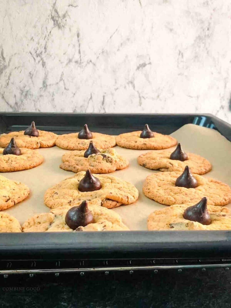 Finished assembled Hershey's special dark chocolate chip cookies on baking sheet.