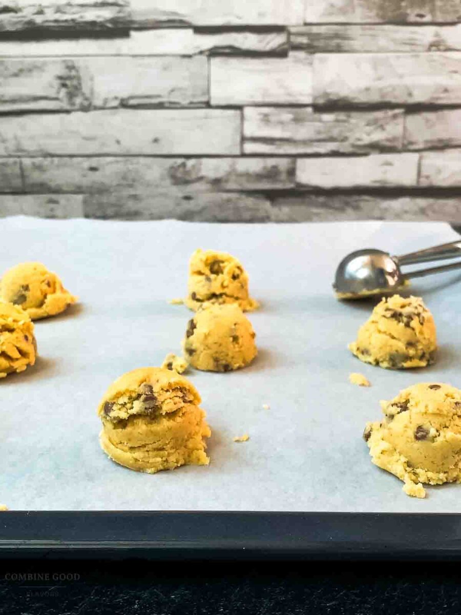 Scoop tablespoon-sized portions of dough onto the prepared baking sheet.