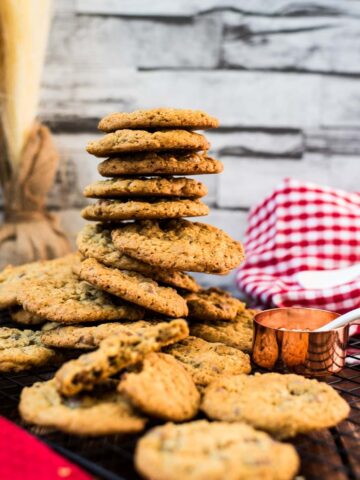 Chocolate chip oatmeal cookies piled on top of each other.