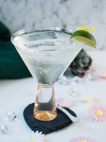 Easy and delicious! Vermouth tonic, in a gorgeous cocktail glass, placed on a black heartshaped slate coaster.