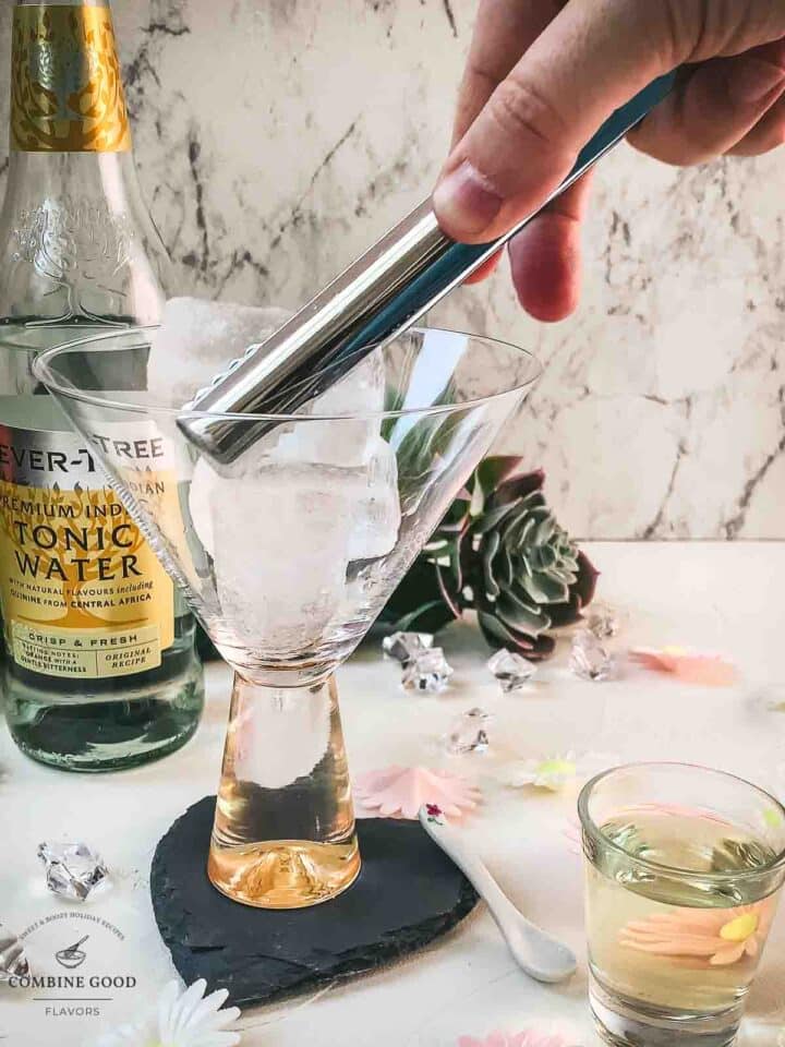 Add cubed ice to the cocktail glass.