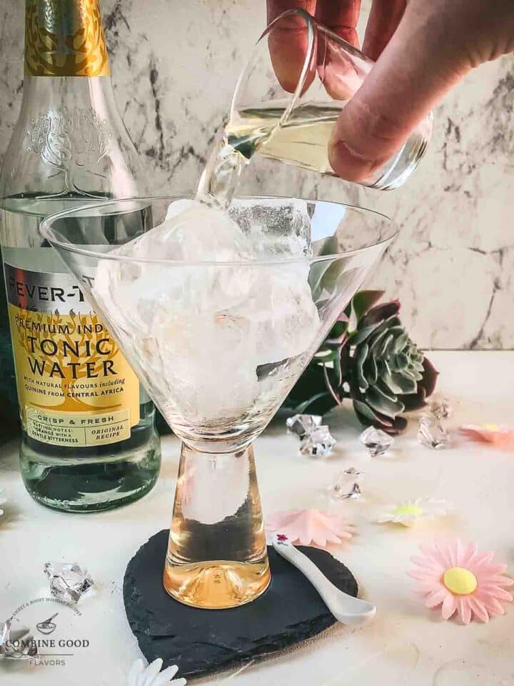 Add vermouth to the cubed ice filled glass.