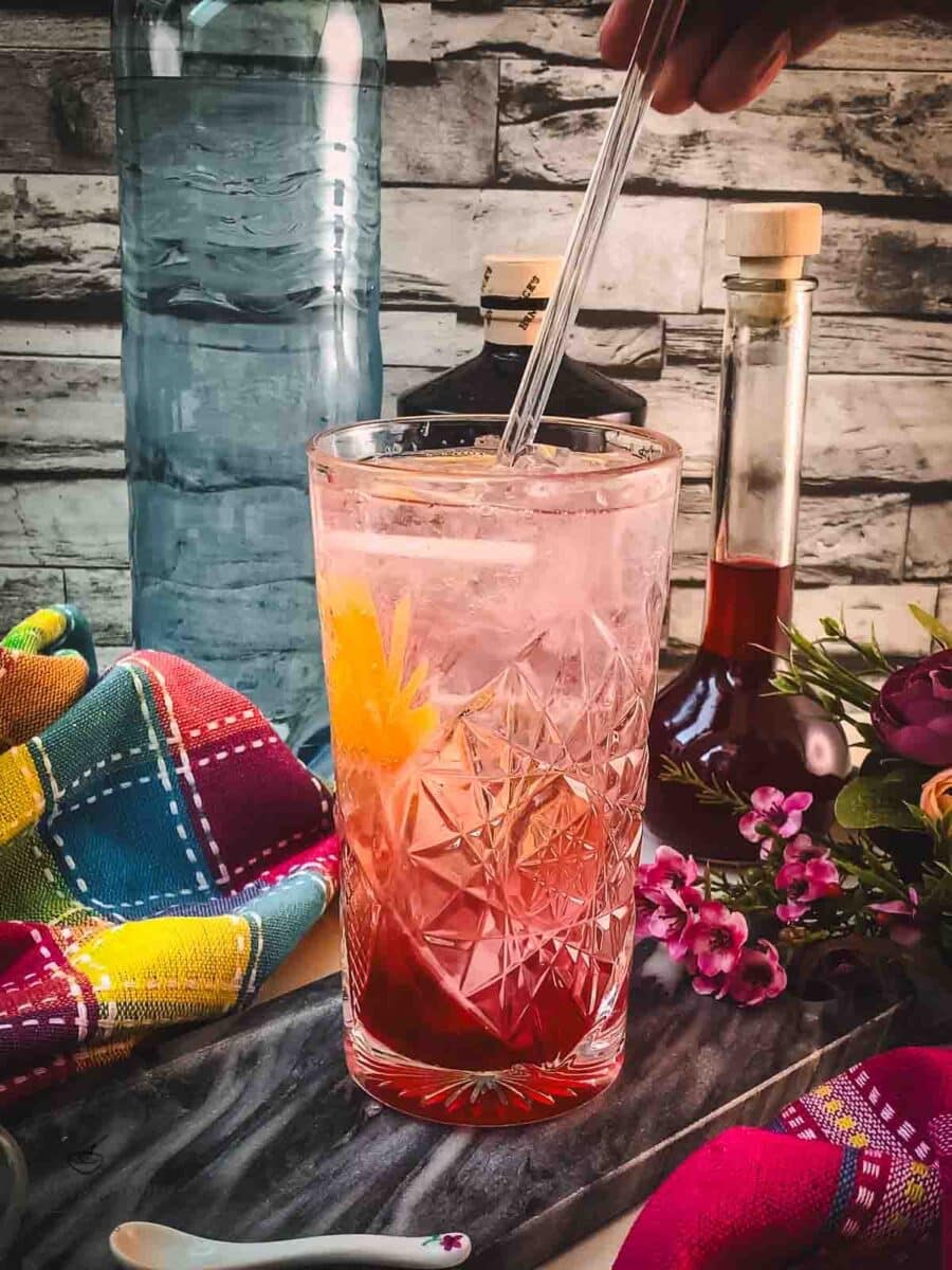 Give your blackberry raspberry gin fizz a good stir.
