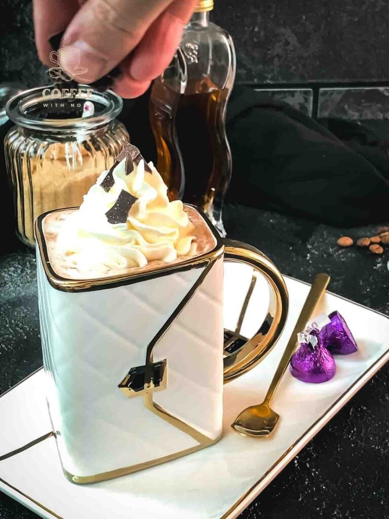 Sprinkle some chocolate shavings on top of the whipped cream.