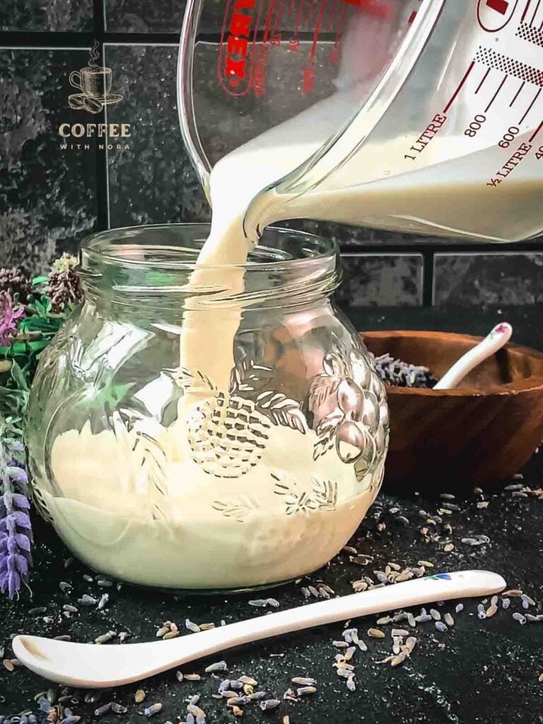 Pour the finished lavender coffee creamer into a preserving jar.