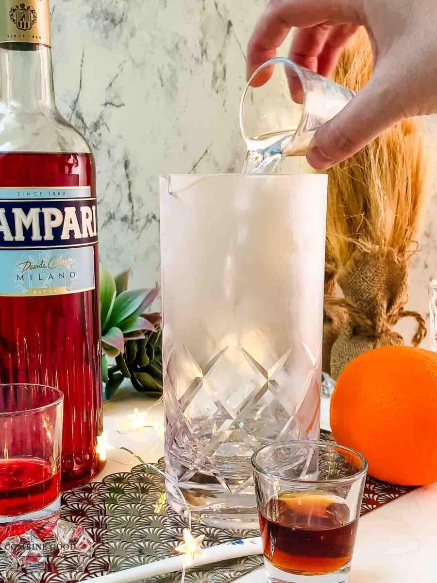Add gin to the stirring glass.