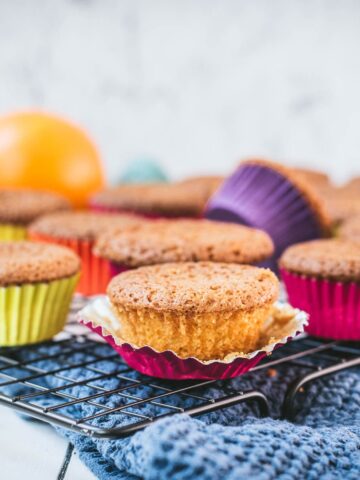 Gorgeous orange muffins placed on cooling rack.