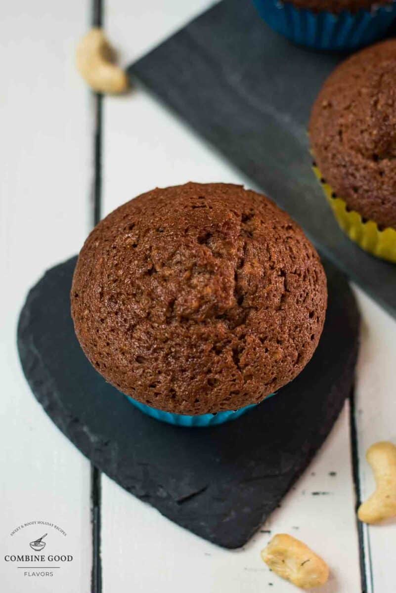 One gorgeous rum muffin placed on heart-shaped black slate coaster.