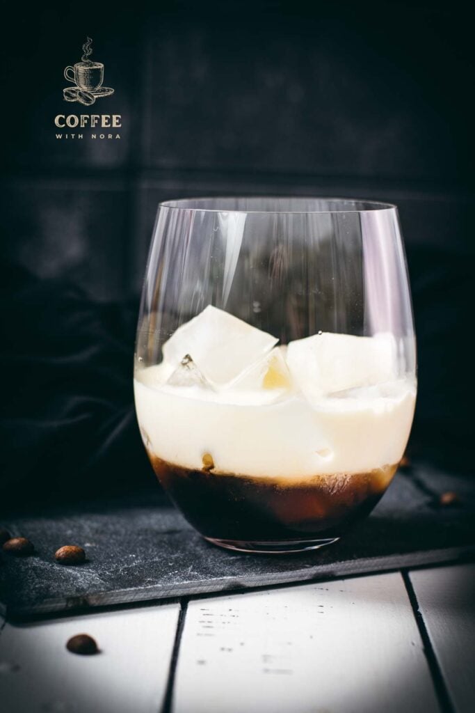 Simple GT glass, filled with delicious brown sugar white Russian. Placed on a black slate plate.