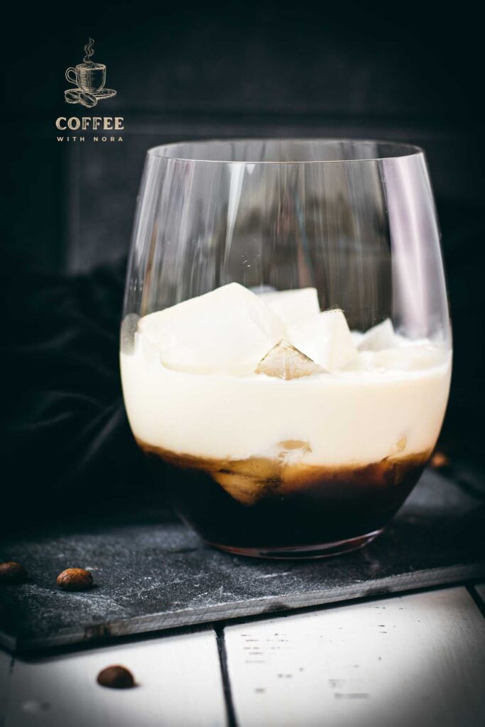 Simple GT glass, filled with delicious brown sugar white Russian. Placed on a black slate plate.