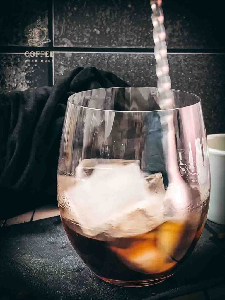 Give vodka, coffee liqueur and brown sugar syrup a good stir.