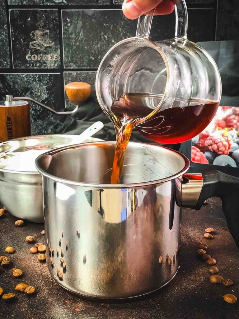 Pour the freshly brewed coffee into a saucepan.