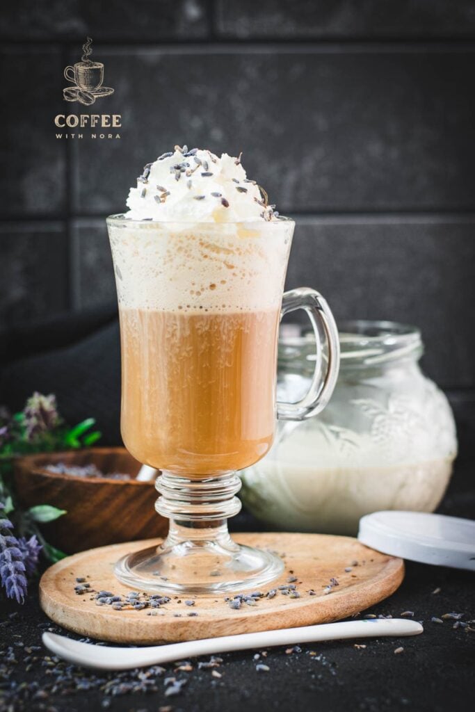 Scrumptious lavender latte, made with homemade lavender coffee creamer. Topped with whipped cream and sprinkled with dried lavender buds.