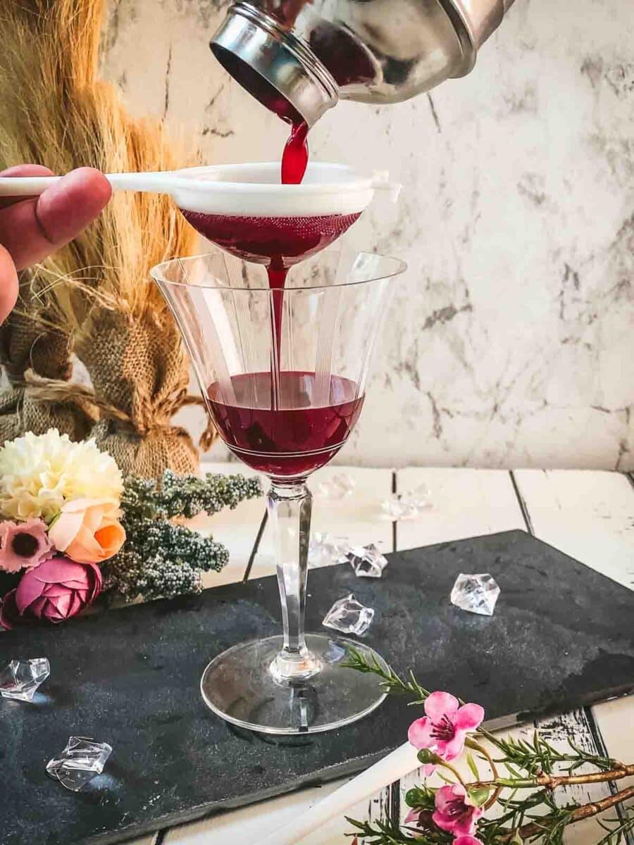 Fine strain the drink into a cocktail glass.