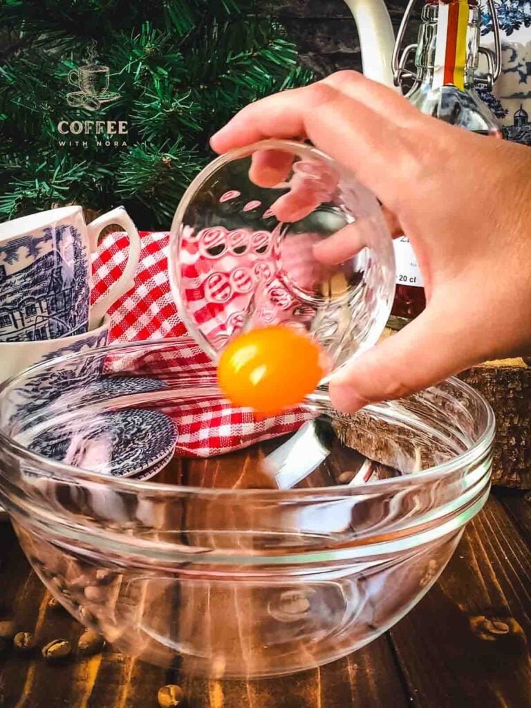 Add an egg yolk to the mixing bowl.