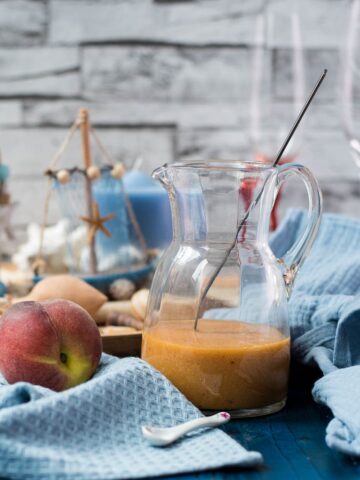 Bellini ready peach puree in a glass jug.