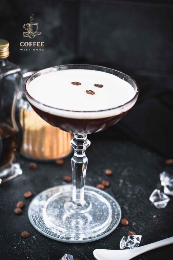 Brown sugar espresso martini placed on mirrored coaster, garnished with three coffee beans.