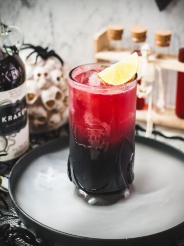 Spooky crimson kraken cocktail with ginger beer and homemade blood syrup.