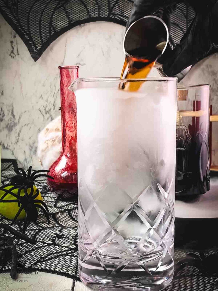 Pour Kraken spiced rum into the chilled stirring glass.