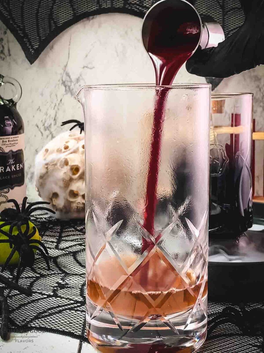 Add homemade berry blood syrup to the stirring glass.