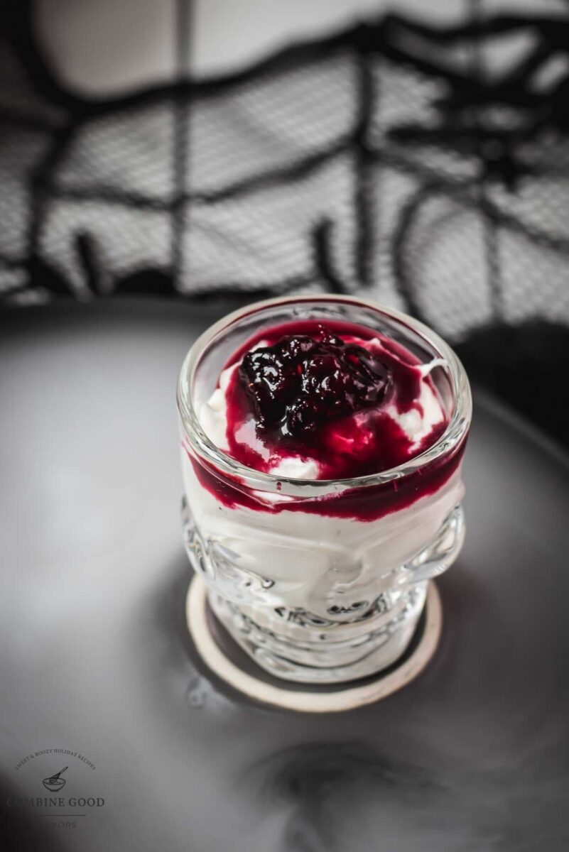 Spooky blood clot berry brains mousse, served in skull shaped shot glasses.